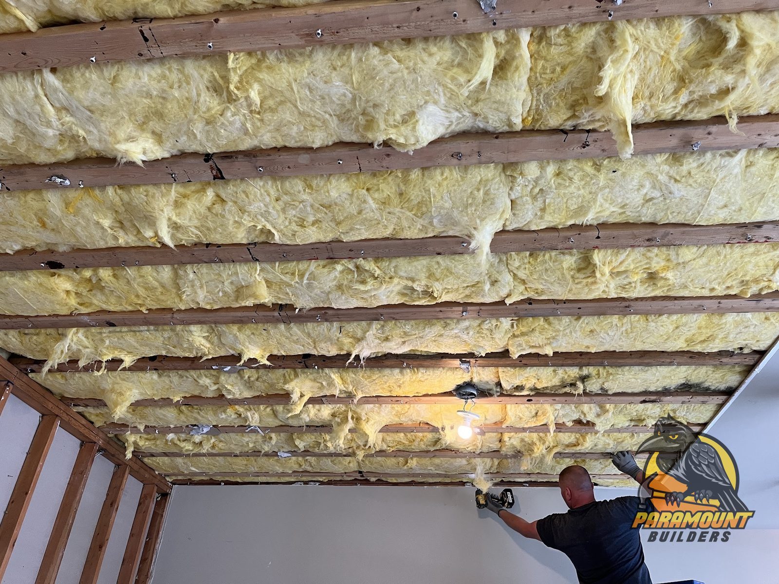 Technician rebuilding an insulated ceiling