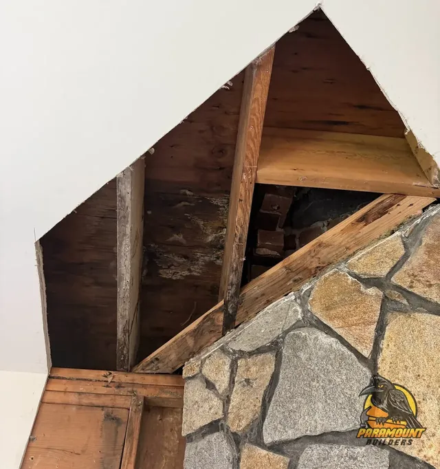 Hidden water damage opened up around a chimney