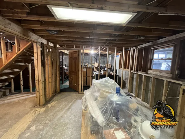 Basement gutted to bare studs, contents covered in poly sheeting - Reconstruction, basement after, South Windsor, CT