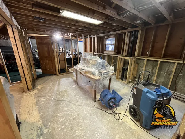Air mover and dehumidifier running in gutted basement with open studs - Reconstruction, basement in progress, South Windsor, CT