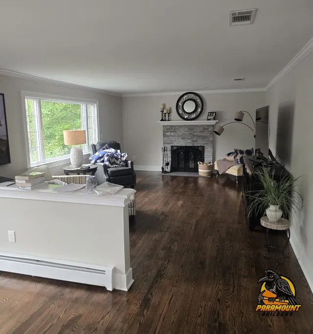 Finished living room with new hardwood floor, crown molding and fireplace - Reconstruction, home finished, South Windsor, CT
