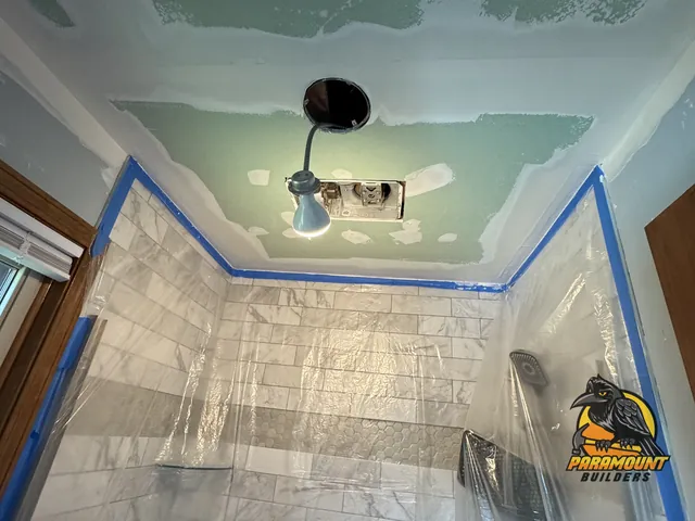 Mudded green ceiling above tiled shower masked with plastic - Reconstruction, home in progress, South Glastonbury, CT