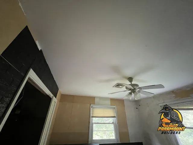 Newly finished ceiling and fan above partially skim-coated walls - Reconstruction, home in progress, Waterbury, CT