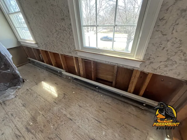 Flood-cut wall with baseboard heat removed over bare subfloor - Reconstruction, kitchen after, South Windsor, CT